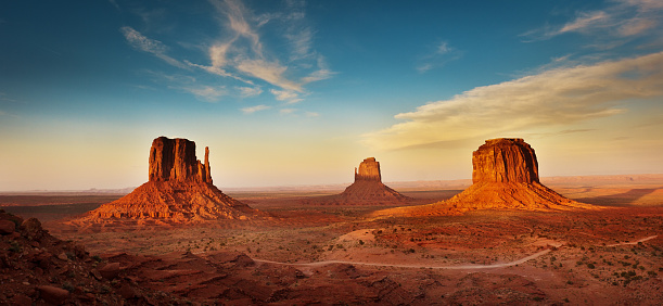 The landscape scenery at the Monument Valley Tribal Park in Arizona, USA. A famous tourist destination in the southwest USA. The iconic western landscape is a backdrop for many western movies.