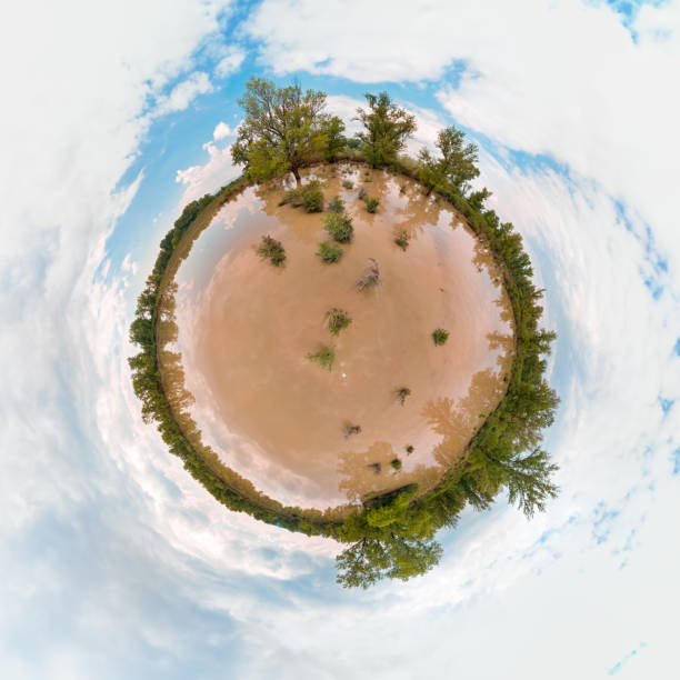 istock Little Planet panorama of flooded meadow. 677833962
