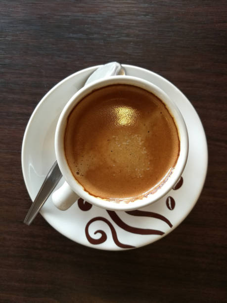 istock Cup of hot espresso coffee on wooden table 677859484