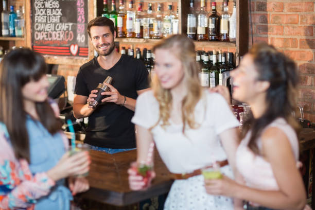 istock Portrait of bartender making drink 677860676