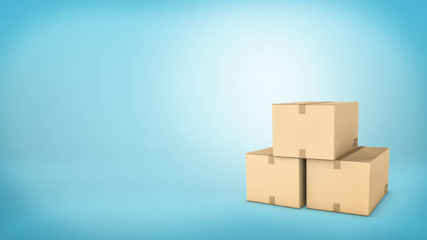 istock Three brown carton boxes closed with a tape and placed together on blue background 677870238