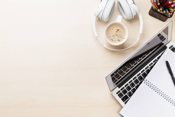 istock Office desk workplace with laptop, coffee and headphones 677872696