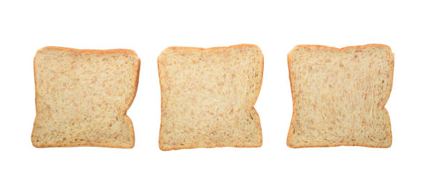 istock Three fresh whole wheat bread slices isolated on white 677872914