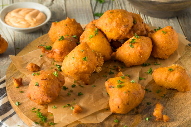 Homemade Deep Fried Hush Puppies Homemade Deep Fried Hush Puppy Corn Fritters hushpuppies stock pictures, royalty-free photos & images