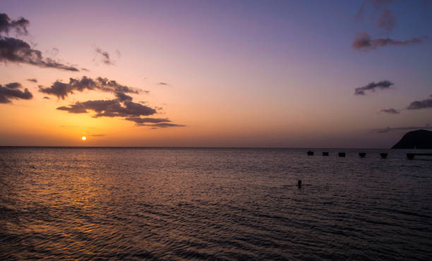 Dominica Island Sunset over Caribbean Sea stock photo