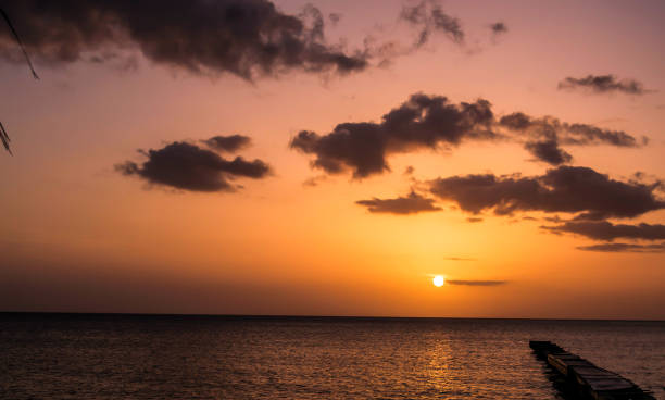 Dominica Island Sunset over Caribbean Sea stock photo