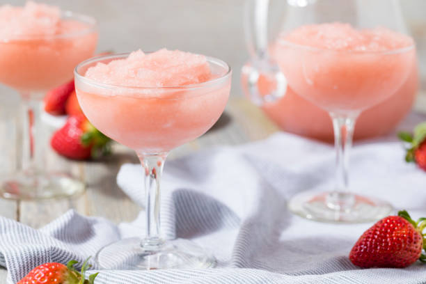 Cold Refreshing Frozen Rosé Wine Cocktail Cold Refreshing Frozen Frosé Rosé Wine Cocktail in the Summer strawberry crush stock pictures, royalty-free photos & images