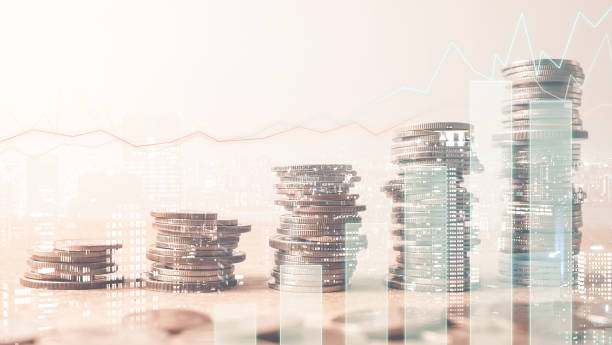 istock Double exposure of graph and rows of coins 677894310