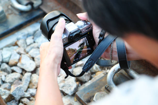istock Closeup  photographer taking picture with digital camera 677922946