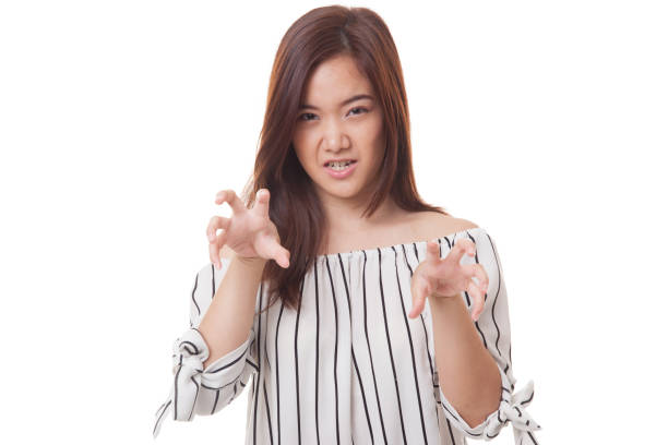 istock Young Asian woman with spooky hands gesture. 677931064