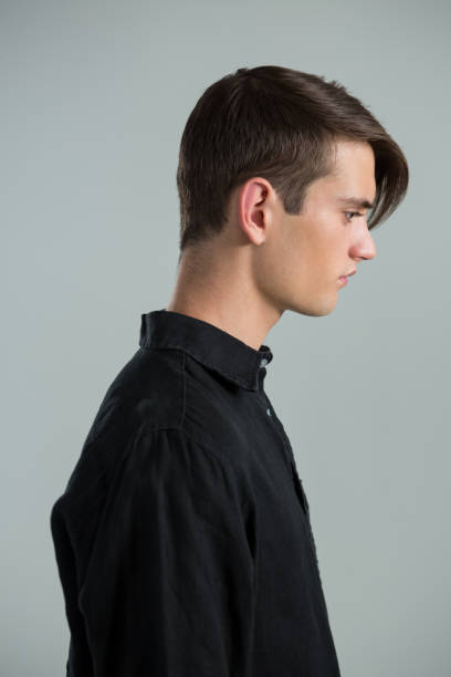 istock Androgynous man in black shirt looking sideways 677943806