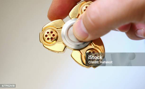 Golden Fidget Spinner Toy On Aurface Stock Photo Download Image Now - Brass, Copper - iStock