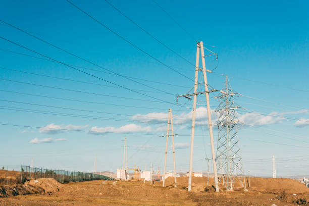 istock electric power transmission pylon on inner mongolia grassland against blue sky  ,China 677955340