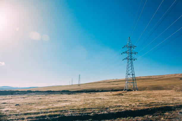 istock electric power transmission pylon on inner mongolia grassland against blue sky  ,China 677958232