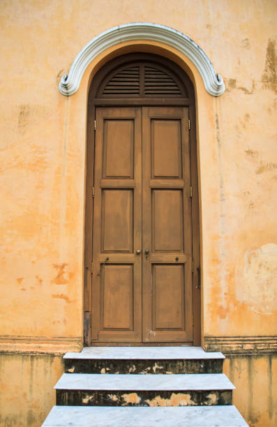 istock Vintage door with the old yellow wall 677965292