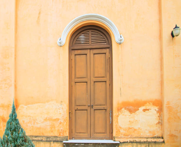 istock Vintage door with the old yellow wall 677965742
