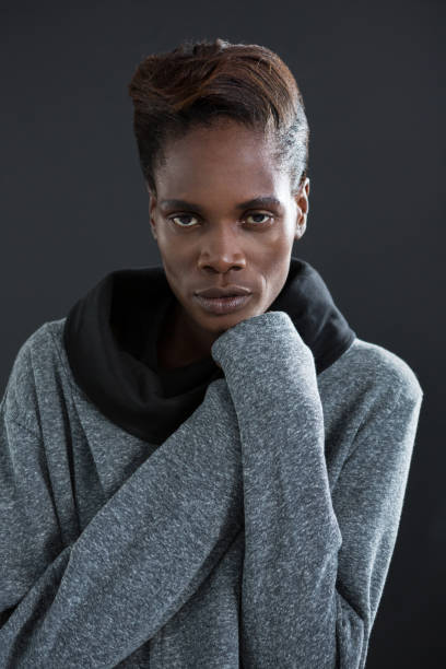 istock Androgynous man posing with hand on his chin 677972778