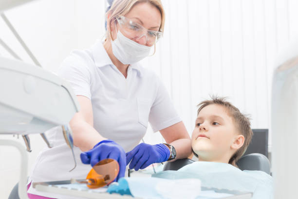 istock The boy heals teeth at the dentist 677977238
