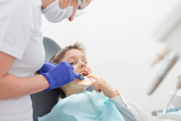 istock boy heals teeth at the dentist 677977354
