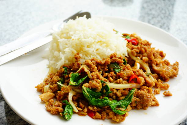 istock Stir fried minced pork and chili ,basil with steamed rice 677983596