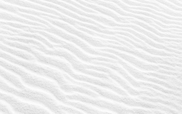 istock Wavy texture of white sand. Abstract background image 678022492
