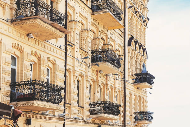 istock An old yellow house with wrought-iron balconies 678040866