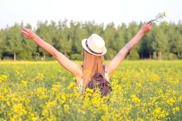 istock Girl in field with open arms 678067466