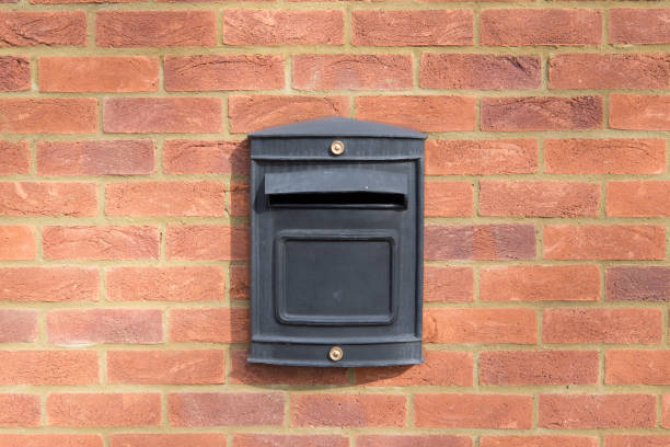 istock black metal letter box on red brick wall 678091968