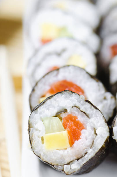 istock Sushi rolls with red fish, cheese and cucumber 678098722