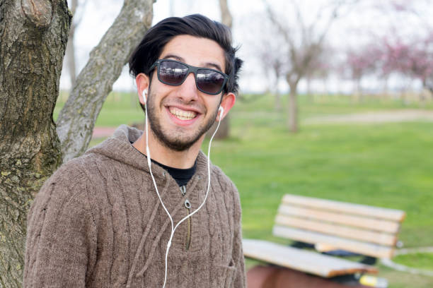 istock Smiley Hipster man in public park 678109284
