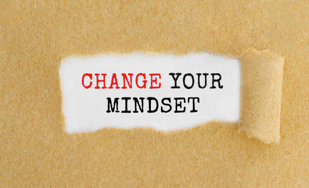 istock Text Change Your Mindset appearing behind ripped brown paper. 678109790