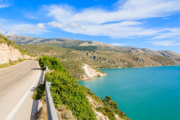 Scenic coastal road along a sea on Kefalonia island, Greece Kefalonia is a Greek island in Ionian Sea. It is the largest of Ionian islands and the sixth largest Greek island. lixouri stock pictures, royalty-free photos & images