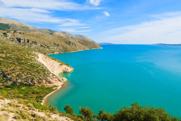 View of sea bay from coastal road near Lixouri town, Kefalonia island, Greece Kefalonia is a Greek island in Ionian Sea. It is the largest of Ionian islands and the sixth largest Greek island. lixouri stock pictures, royalty-free photos & images