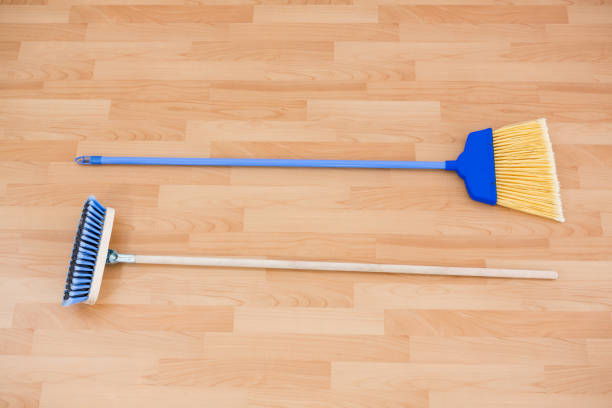 istock Hgh angle view of long handle brooms 678114948