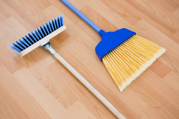 istock Close up of long handle brooms 678115156