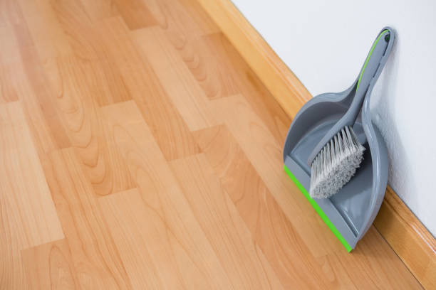istock High angle view of dustpan and brush against wall 678120108