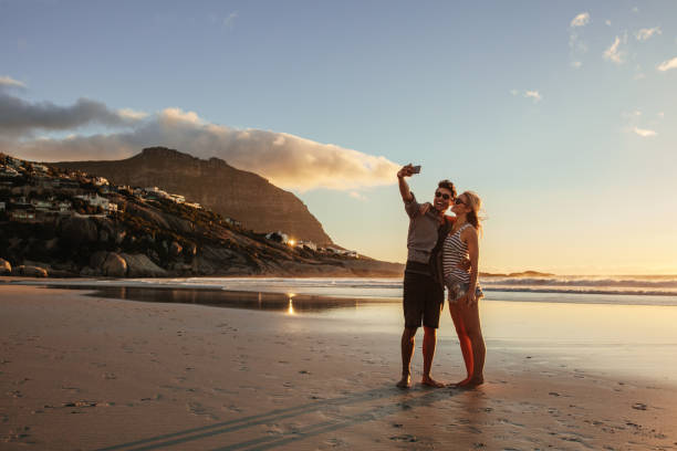 istock Romantic young couple taking selfie 678128160