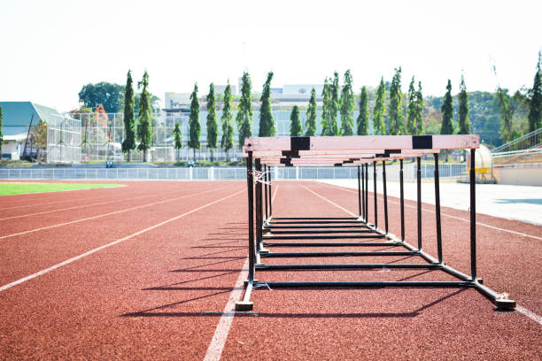 istock hurdle race on stadium track 678129326