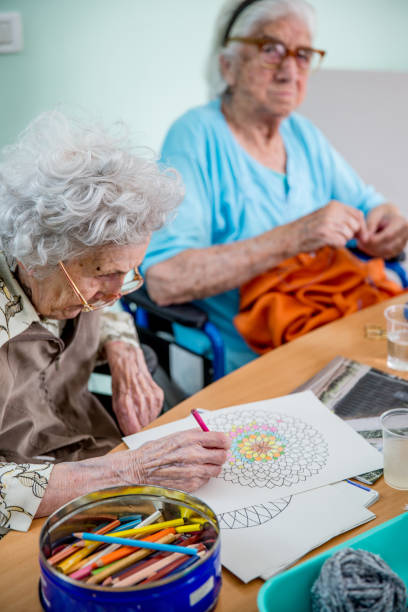 istock Senior Woman Coloring Mandala 678130436