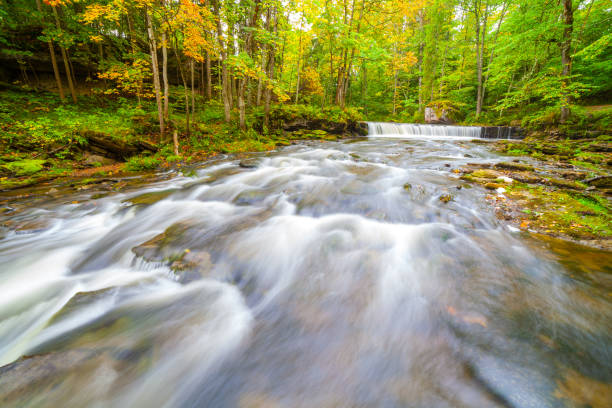istock Small waterfall (cascade) on river with motion blur. Lahemaa national park, Estonia 678131998