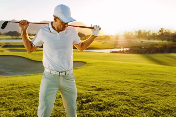 istock Golfer with golf club at course on a summer day 678132776