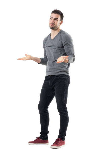 istock Clueless confused young man shrugging shoulders looking away 678134140