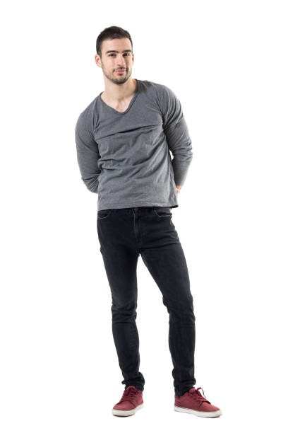 istock Young handsome casual man with hands behind back smiling at camera 678138542