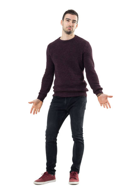 istock Smiling puzzled man wearing maroon sweater with spread arms looking up. 678147806