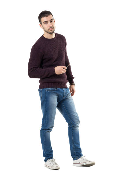 istock Relaxed young handsome casual man holding sunglasses looking at camera 678148394