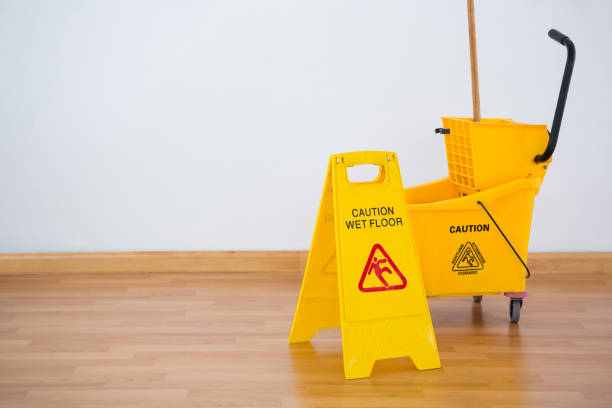 istock Yellow sigh boad with mop bucket on floor against wall 678159174