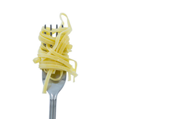 istock Close-up of pasta rolled up in fork 678164168