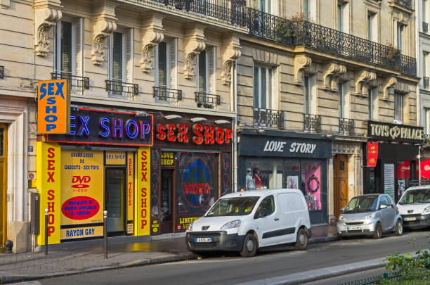 Sex shops on Boulevard de Clichy, Paris, France. Paris: A variety of sex shops on Boulevard de Clichy. Quartier Pigal (red light district) in Paris, France. Morning, there are no clients and so everything is closed. place pigalle stock pictures, royalty-free photos & images