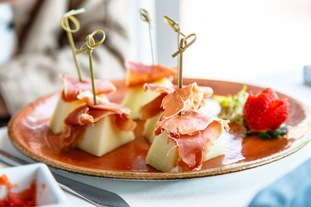 istock Melon with Serrano ham lay on the plate. 678170780