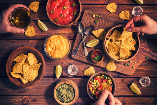 istock Family Eating Nachos With Sauces 678178244